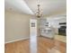 Bright dining room features hardwood floors and kitchen view at 3762 San Luis Dr, Sarasota, FL 34235