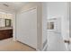 Hallway with linen closet and bathroom view at 3762 San Luis Dr, Sarasota, FL 34235