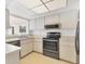 Modern kitchen with stainless steel appliances and ample counter space at 3762 San Luis Dr, Sarasota, FL 34235