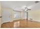 Spacious living room with hardwood floors and ceiling fan at 3762 San Luis Dr, Sarasota, FL 34235