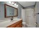 Bathroom with a shower, vanity, and a framed mirror at 3815 42Nd W Ave, Bradenton, FL 34205