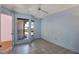 Light blue bedroom with tile floors, a window, and double doors at 3815 42Nd W Ave, Bradenton, FL 34205