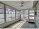 Bright screened porch with ceiling fan and access to backyard at 3815 42Nd W Ave, Bradenton, FL 34205