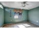 Cozy spare bedroom with tile floors and ceiling fan at 3815 42Nd W Ave, Bradenton, FL 34205