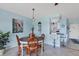 Dining area features tile flooring, seating for four, and access to the kitchen at 3880 Ironwood Ln # 408E, Bradenton, FL 34209