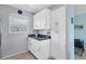 Kitchen featuring white cabinets, granite countertops, and a window with a neighborhood view at 3880 Ironwood Ln # 408E, Bradenton, FL 34209