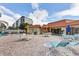 Relaxing pool area featuring comfortable lounge chairs, tables with umbrellas, and beautiful landscaping at 3880 Ironwood Ln # 408E, Bradenton, FL 34209