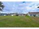 View of homes and large grassy backyard at 3911 Douglas Hill Pl, Parrish, FL 34219