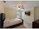 Spacious bedroom with large bed, TV, ceiling fan, and ample closet space at 3911 Douglas Hill Pl, Parrish, FL 34219