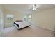 Large bedroom with ceiling fan and neutral carpeting at 3911 Douglas Hill Pl, Parrish, FL 34219