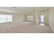 Bright living room featuring neutral walls and carpet at 3911 Douglas Hill Pl, Parrish, FL 34219