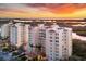 Luxury condo building at sunset with water views at 393 N Point Rd # 604, Osprey, FL 34229