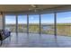 Relaxing balcony boasting panoramic water views and tiled floor at 393 N Point Rd # 604, Osprey, FL 34229