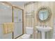 Small bathroom with pedestal sink, toilet and shower at 393 N Point Rd # 604, Osprey, FL 34229