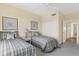 Guest bedroom with twin beds and ample closet space at 393 N Point Rd # 604, Osprey, FL 34229