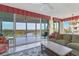 Spacious living room with balcony access and water views at 393 N Point Rd # 604, Osprey, FL 34229