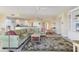 Living room featuring a green sectional sofa, built in shelving and area rug at 393 N Point Rd # 604, Osprey, FL 34229