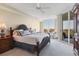 Spacious main bedroom with king bed and access to balcony at 393 N Point Rd # 604, Osprey, FL 34229