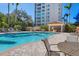 Relaxing pool area with seating and a shaded patio at 393 N Point Rd # 604, Osprey, FL 34229