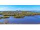 Expansive view of calm water, mangrove islands, and shoreline at 393 N Point Rd # 604, Osprey, FL 34229