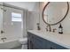 Modern bathroom with white subway tiles, a soaking tub, and stylish vanity at 3950 Sawyerwood Rd, Sarasota, FL 34233