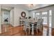 Farmhouse-style dining room with wooden table and access to backyard at 3950 Sawyerwood Rd, Sarasota, FL 34233