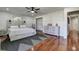 Main bedroom with wood floors and a dresser at 3950 Sawyerwood Rd, Sarasota, FL 34233