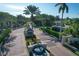 Gated entrance to Bird Key community, featuring fountain and landscaping at 419 Partridge Cir, Sarasota, FL 34236