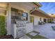 Modern outdoor kitchen with grill and stone tile accents at 419 Partridge Cir, Sarasota, FL 34236