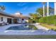 Inviting pool area with patio furniture and lush landscaping at 419 Partridge Cir, Sarasota, FL 34236