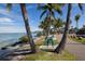 Waterfront path, palm trees, blue bike rack at 419 Partridge Cir, Sarasota, FL 34236