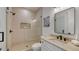 Clean bathroom with a walk-in shower and modern vanity at 421 Pine Ave, Anna Maria, FL 34216