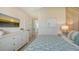 Guest bedroom with a king-size bed and calming decor at 421 Pine Ave, Anna Maria, FL 34216