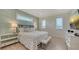 Relaxing bedroom with a king-size bed and calming decor at 421 Pine Ave, Anna Maria, FL 34216