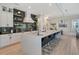 Modern kitchen with white cabinets and hexagon backsplash at 421 Pine Ave, Anna Maria, FL 34216