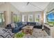 Relaxing living room with sectional sofa and wood coffee table at 421 Pine Ave, Anna Maria, FL 34216