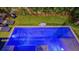 Relaxing pool and putting green in backyard at 421 Pine Ave, Anna Maria, FL 34216