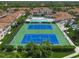 Aerial view showing tennis courts and pool at 4215 Breezeway Blvd # 2420, Sarasota, FL 34238