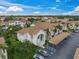 Aerial view of condo, parking, and landscaping at 4215 Breezeway Blvd # 2420, Sarasota, FL 34238