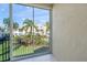 View from condo balcony showcasing lush green space at 4215 Breezeway Blvd # 2420, Sarasota, FL 34238