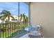 Private balcony with table and chairs overlooking the community at 4215 Breezeway Blvd # 2420, Sarasota, FL 34238