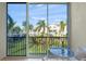 Condo balcony with table and chairs and view of the community at 4215 Breezeway Blvd # 2420, Sarasota, FL 34238