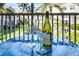 Relaxing balcony with table and chairs, offering a view of lush landscaping at 4215 Breezeway Blvd # 2420, Sarasota, FL 34238