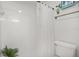 Simple bathroom with shower/tub combo and white tile at 4215 Breezeway Blvd # 2420, Sarasota, FL 34238