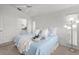 Bright bedroom with a king-size bed and plenty of natural light at 4215 Breezeway Blvd # 2420, Sarasota, FL 34238