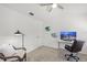 Bright bedroom with a desk, chair, and ceiling fan at 4215 Breezeway Blvd # 2420, Sarasota, FL 34238