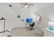 Spacious bedroom with a home office setup and ceiling fan at 4215 Breezeway Blvd # 2420, Sarasota, FL 34238