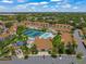 Aerial view of community pool, tennis courts, and clubhouse at 4215 Breezeway Blvd # 2420, Sarasota, FL 34238