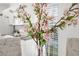 Close-up of a vase of flowers on a dining table at 4215 Breezeway Blvd # 2420, Sarasota, FL 34238