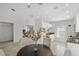 Casual dining area with dark wood table and chairs, near kitchen and living room at 4215 Breezeway Blvd # 2420, Sarasota, FL 34238